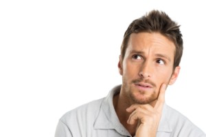 Portrait Of Thoughtful Young Man Isolated On White Background