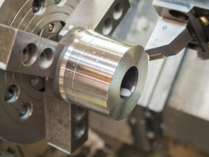 operator machining mold and die parts for automotive by CNC lathe